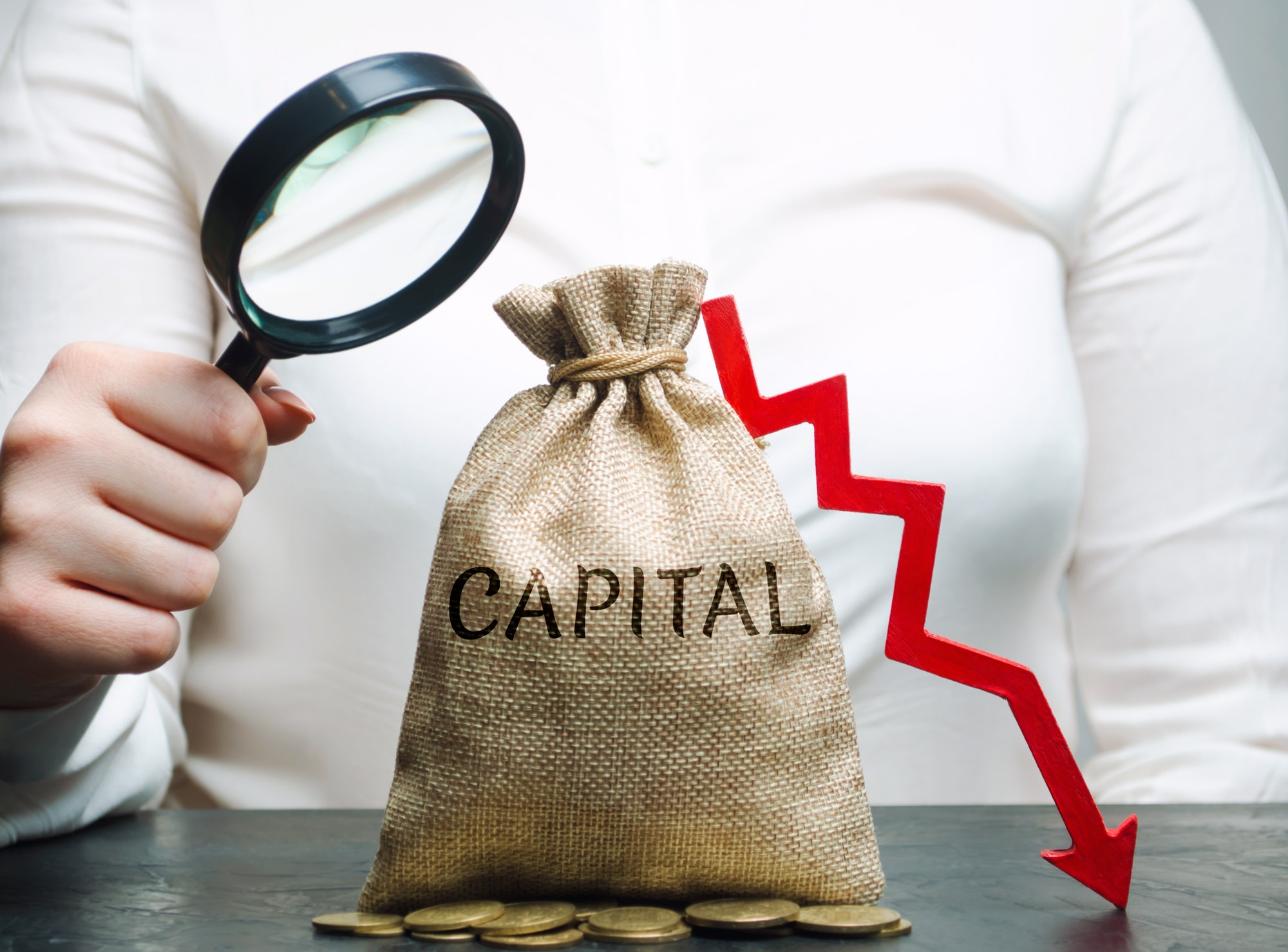 Woman analyzes data on the cost of capital in the company